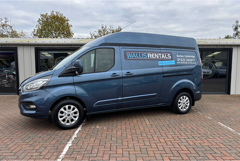 An image of a blue Transit Van parked on the Wallis & Son forecourt.